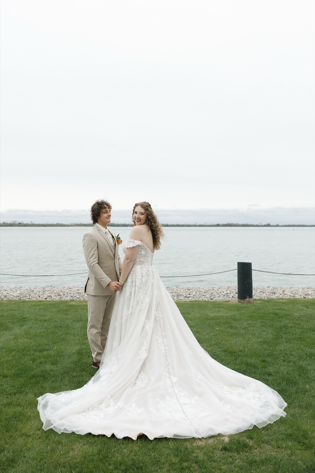 Newlyweds at the river&rsquo;s edge